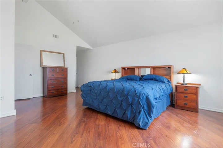 This room is very large and has an area for a private living area to watch tv and have desk for working