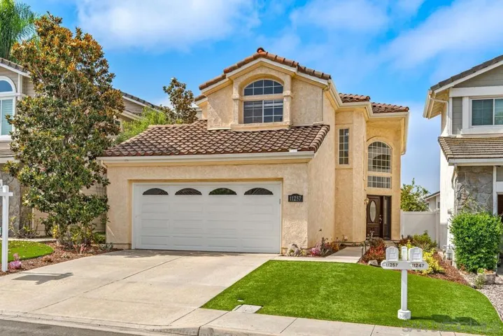 Note the excellent curb appeal of this home.  Exterior paint, roll up garage door, newer front door and water saving plants and turf.