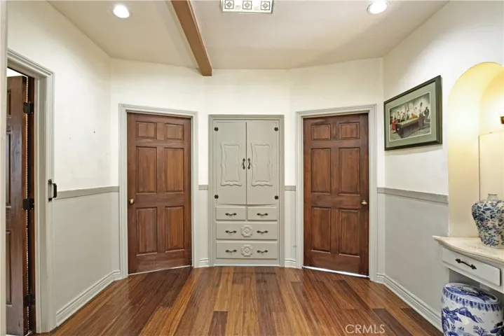 2nd foyer - 1st bathroom on left, primary bedroom, linen closet, 2nd bedroom and original telephone nook
