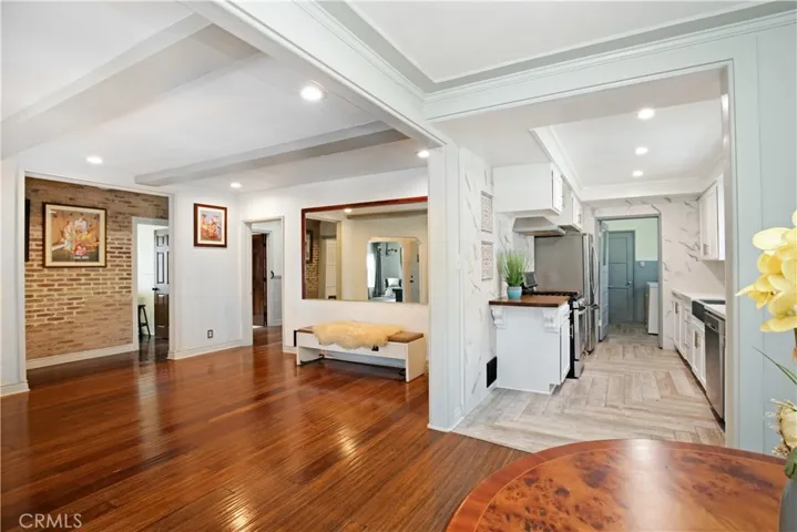 EASY ENTERTAINING as space seamlessly flows from dining room to nook to kitchen