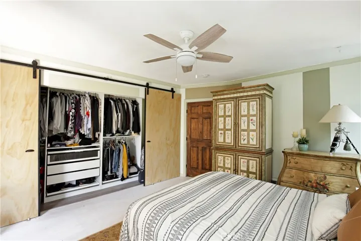 BEDROOM 1 - expansive custom closet with boutique-style shelf organization