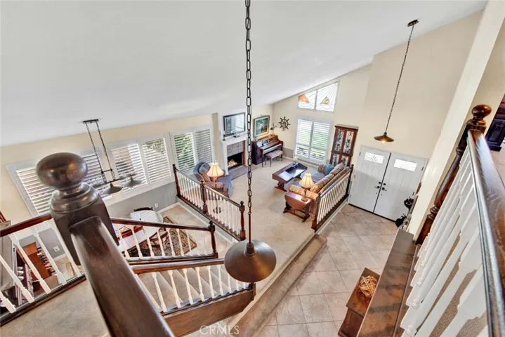 Dramatic View of Formal Living Room, Dining Room, and Foyer with Soaring Ceilings