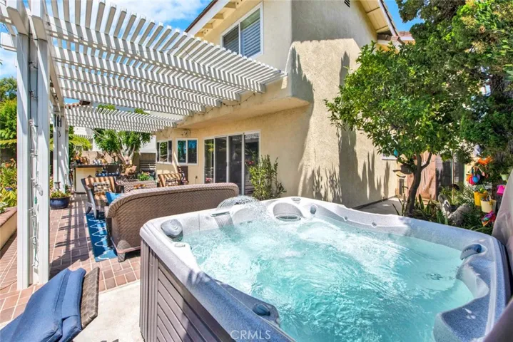 Bubbling Hot Tub with Outdoor Shower in Side Yard