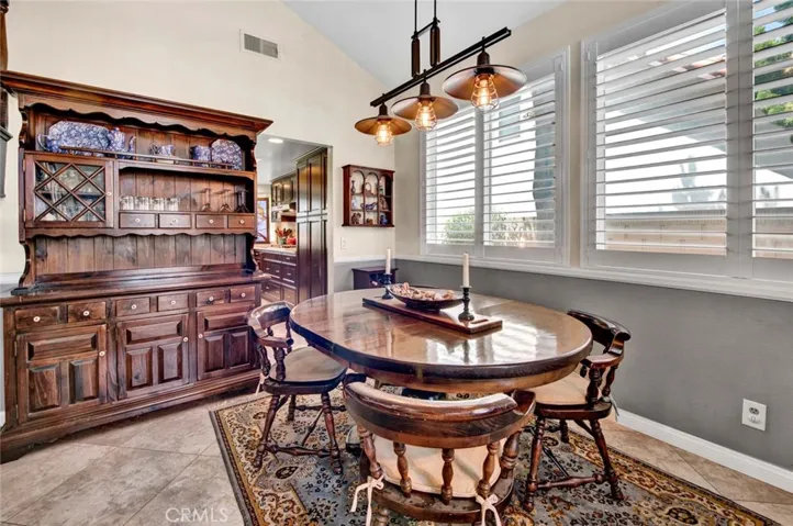 Formal Dining Room with Soaring Ceiling and Restiration Hardware Type Light Fixture