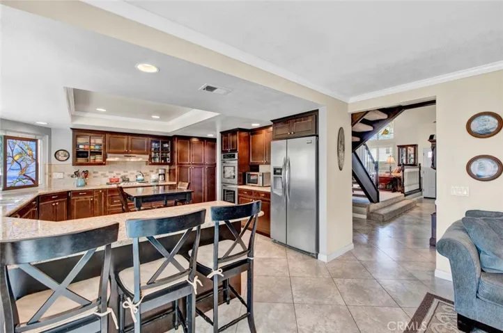 Kitchen Open and Family Room and 2-Way Flow into Living, Dining, and Entry