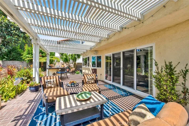 Brick Patio with Alumawood Covering and Built-In BBQ Center - this backyard is made for Entertaining and Relaxing