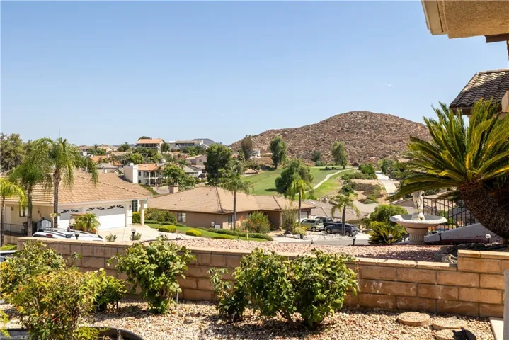 The porch enjoys these serene golf course/rolling mountain views!