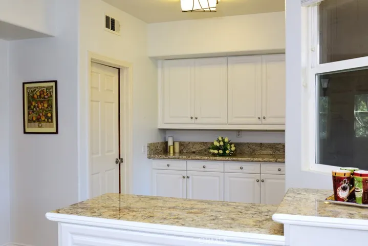 extra storage space off the dining area in the kitchen.