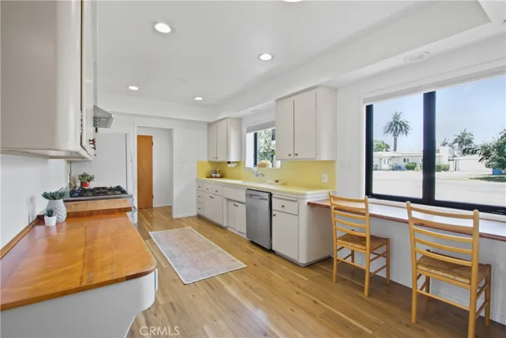 The mid-century modern kitchen has a breakfast nook.