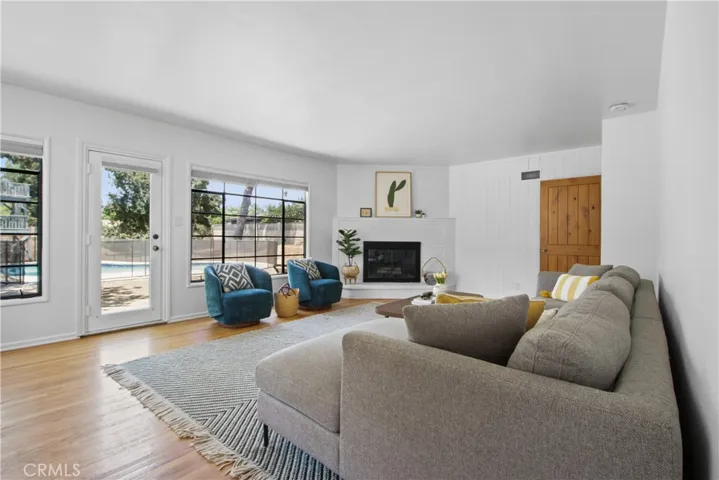 The living room is light, bright an airy, and has a gas log fireplace.