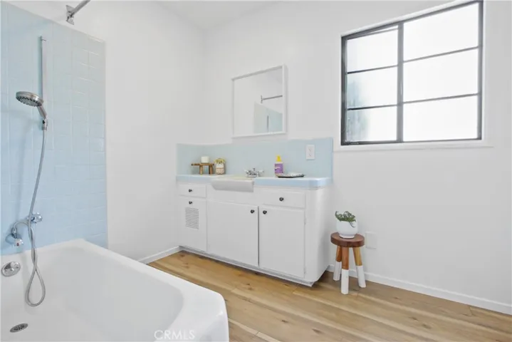The primary bathroom has a shower/tub and single vanity.