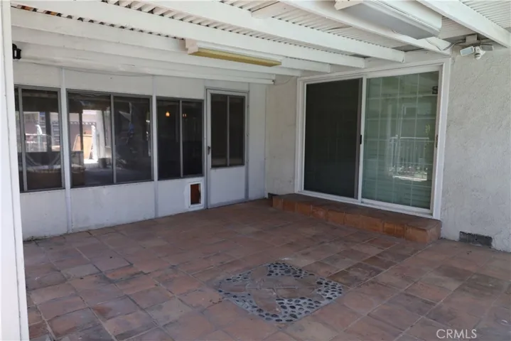 Outdoor patio off Master bedroom looking towards Pool and Spa