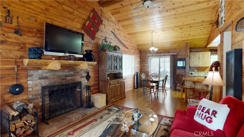 Living Room view from front door pine wood panels