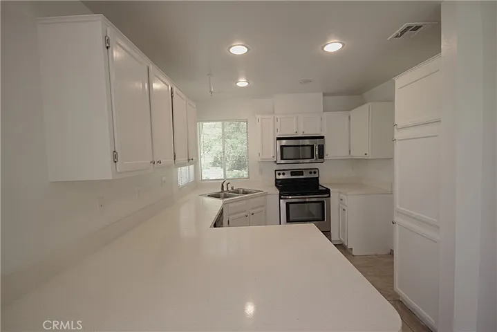 Kitchen with stainless steel appliances.