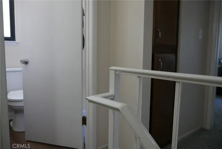 2nd Floor Landing: door to full bath, linen cabinets, large storage closet out of view to right.