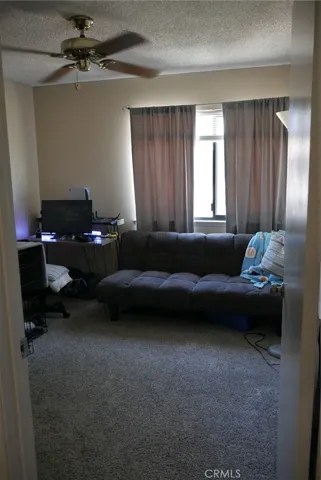 2nd Floor, 2nd Bedroom: large room, newer carpeting, ceiling fan, large window, nice blinds & drapes.