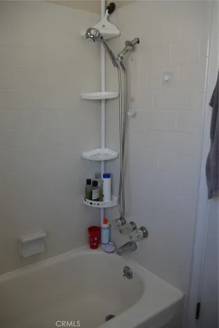 2nd Floor Full Bathroom: tub/shower combo, full-sized tub, full tile tub surround.