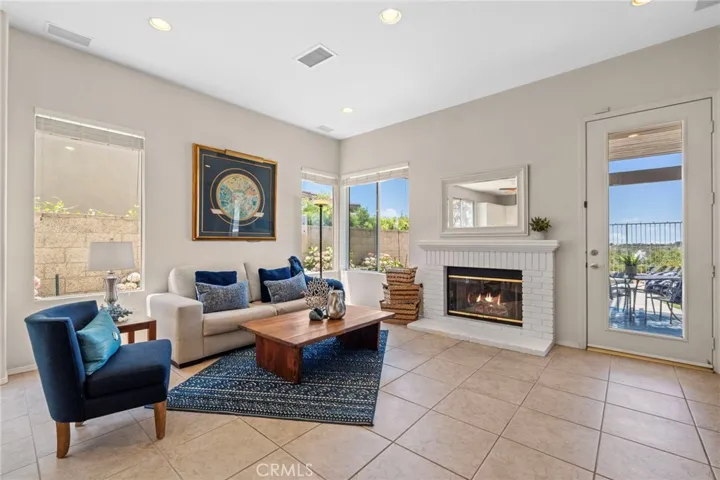 The family room features ample seating, inviting fireplace and of course views...