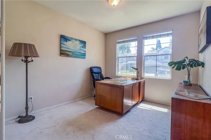 Downstairs bedroom with a closet could easily serve as an office.