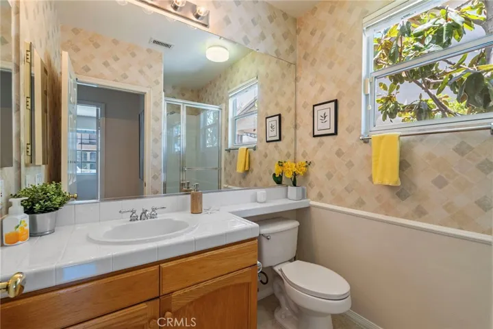 Adjacent to the downstairs bedroom, a full bathroom.