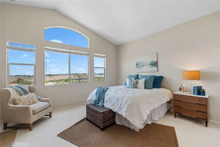 Primary Suite Haven features floor to ceiling views, reading space, fireplace, elegant soaking tub, shower, dual sinks, and generous walk-in closet.