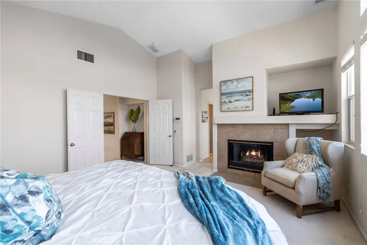 Indulge in the ultimate relaxation experience in the Primary Suite featuring stunning views, fireplace, soaking tub, shower, and generous walk-in closet.
