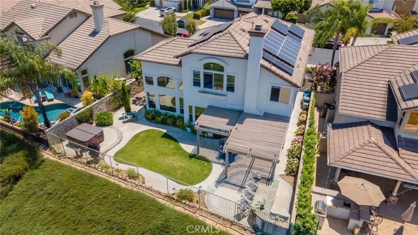 Aerial view of gorgeous home, back yard and spa.