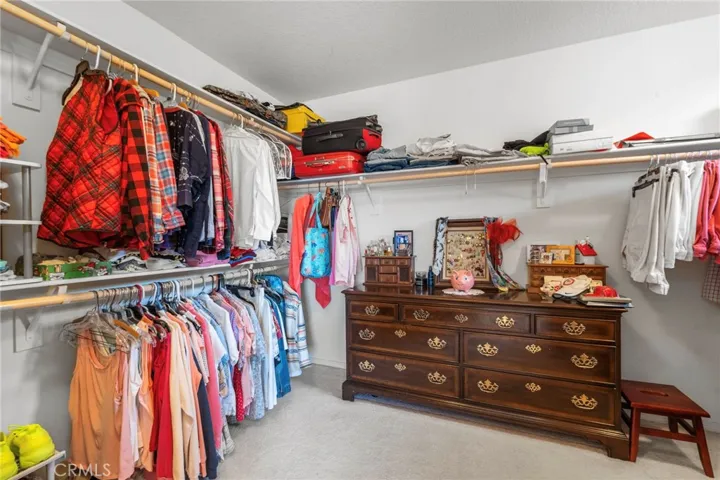 Sizable walk-in closet with ample natural light.