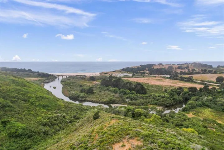 Overhead shot (off property) of creek, bridge on Hwy 1, Hwy 84 & Hwy1, and San Gregorio State Beach