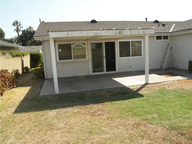 Rear of home and nice side yard.