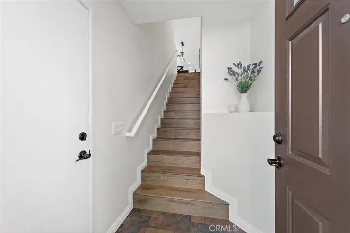Entrance from garage and beautiful stairs