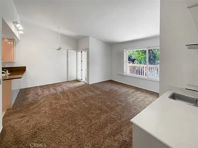Family room opens from kitchen to dining deck, dining nook, BBQ deck