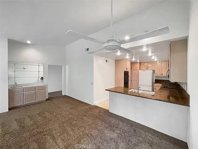 Spacious family room connected to the kitchen.