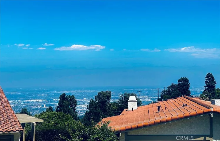 From the living room balcony. Los Angeles, city lights and snow on the mountains in winter and ocean glimpse on a clear day :)