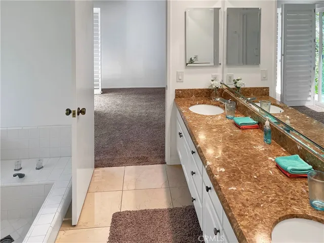Primary bath with soaking tub and separate shower.