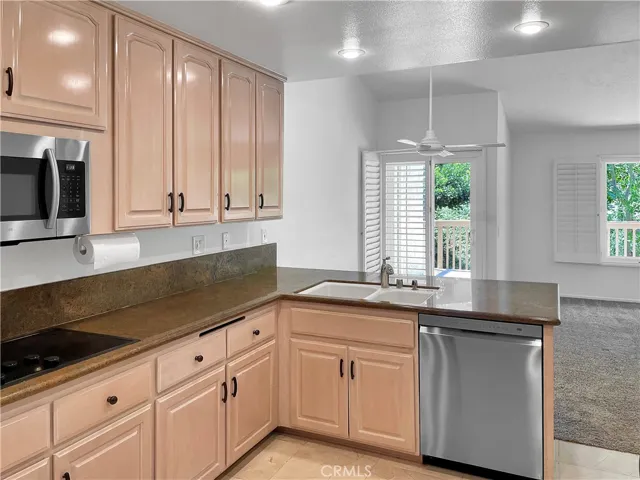 Kitchen opens to dining room, den and BBQ deck.