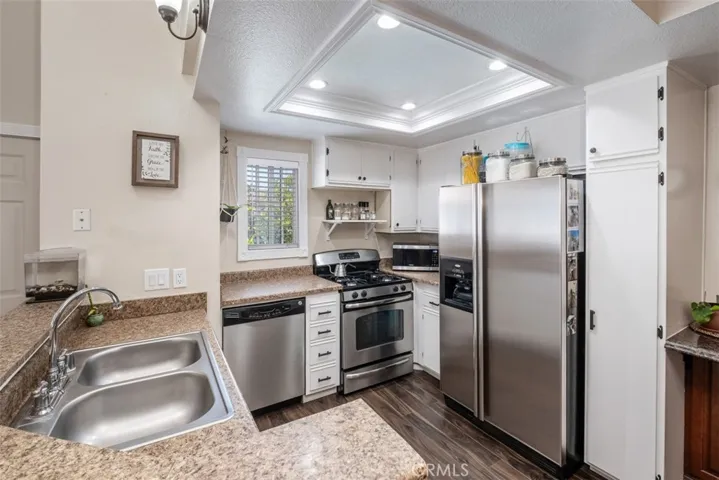 Here is a view of the kitchen complete with stainless steel appliances