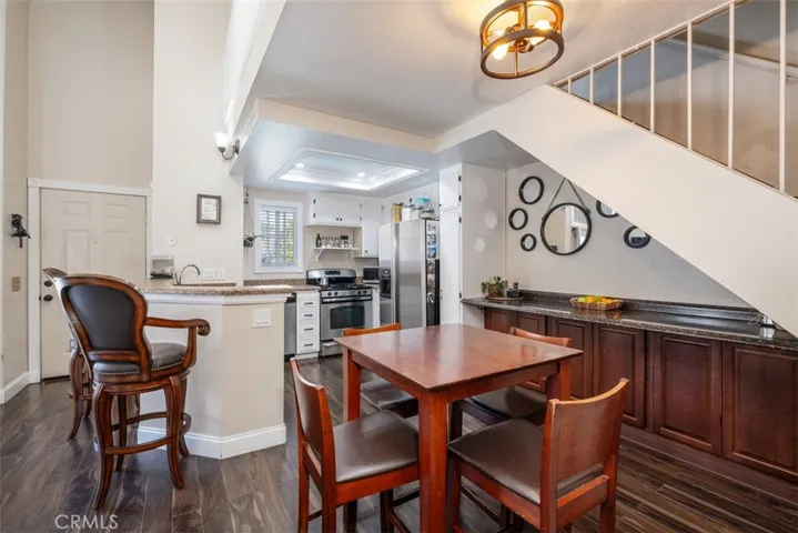 Here is a look from the hallway into the dining room with built-in cabinets just off the kitchen