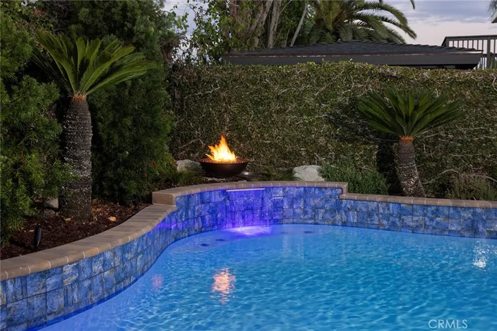 Night Pool with Fire Bowl and Waterfall