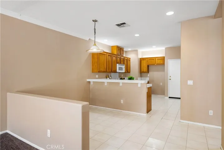 Family room to breakfast nook and kitchen