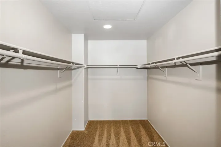 Walk-in closet in primary bedroom