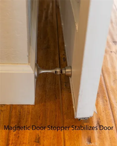Magnetic door stopper to stabilize front door.