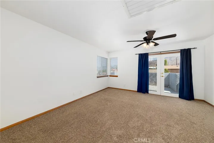 Upstairs Masterbedroom with balcony.