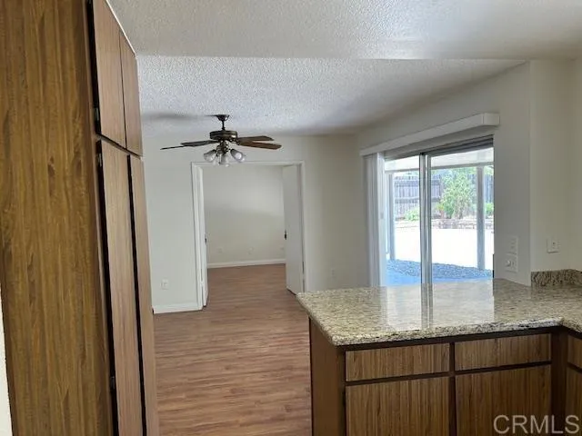 Kitchen looking across DR to downstairs BR