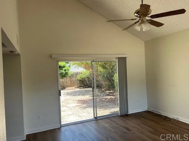 Livingroom and slider to backyard.