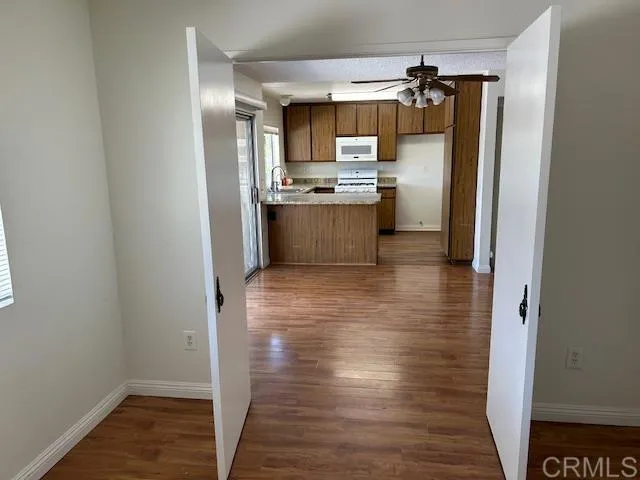 Downstairs BR looking to Kitchen/DR