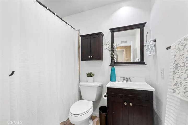 Full bathroom in hallway across from bedrooms 2 & 3.