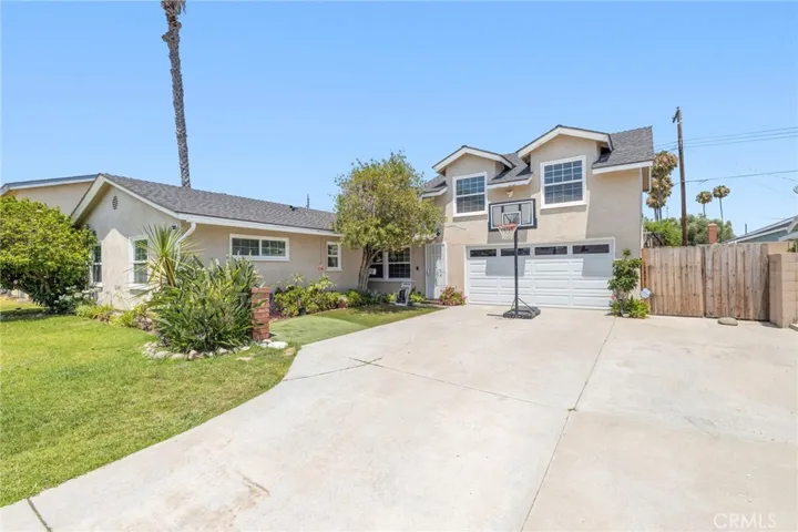 Driveway can fit 6 vehicles or 4 cars and an RV!  Large 2 car garage with access to the rear of the house.