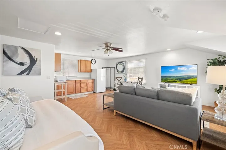 Lots of windows, high ceilings and recessed lights.