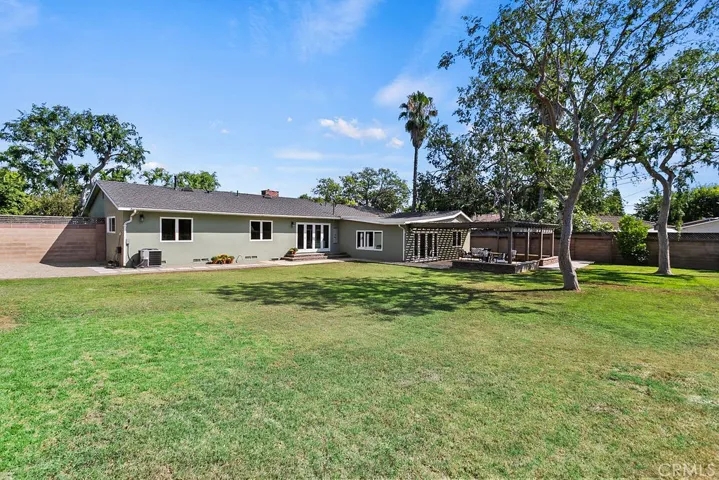 The patio, living room, family room and two of the bedrooms overlook the huge park-like backyard...